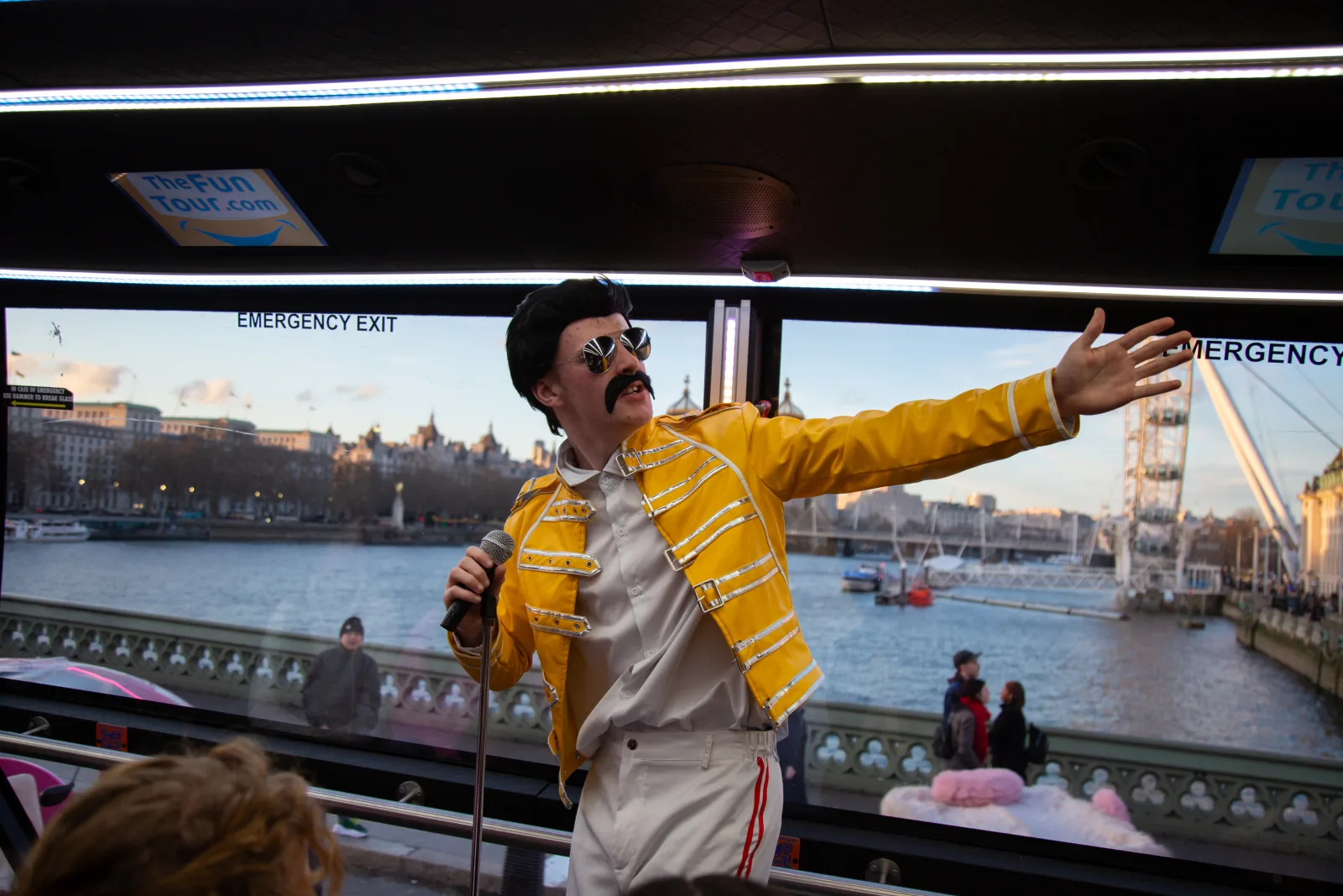 Rock legend character on the bus with the London Eye behind